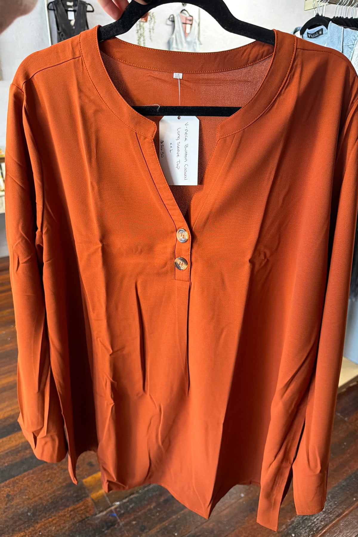 Orange long sleeve top, v-neck button up
